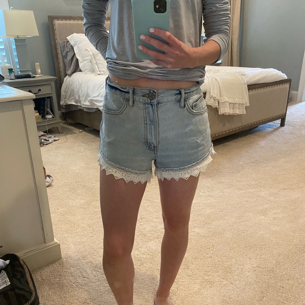 Free People jean shorts with lace trim